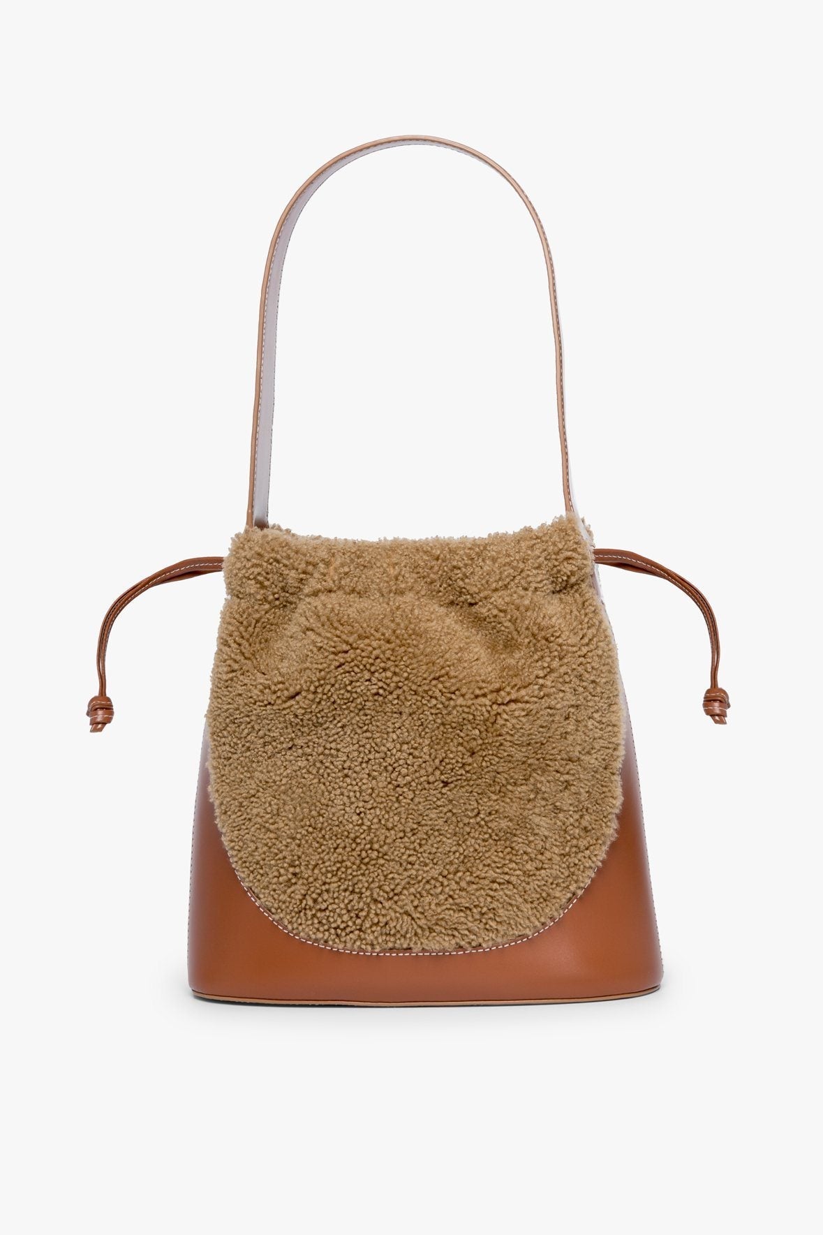 Image CINCH SHEARLING BUCKET BAG | NATURAL TAN 1 of 7 and Clicking this image will trigger a zoom pop-up